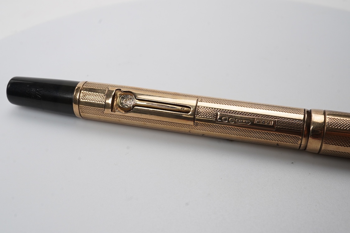 A Waterman FDW 9ct. gold lever fill fountain pen in lined engine turned decoration fitted with Waterman 14ct. gold nib